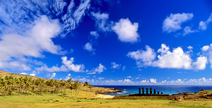 Moai statues palm trees and beach on Easter Island. by Marco Brivio