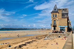 People relax at a cafe near Grand Plage du Sillon in Saint Malo