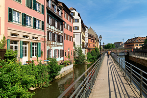 Visitors walk along the canal in Petit France Strasbourg by Marco Brivio