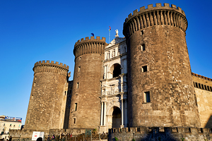 Castel Nuovo stands strong in Naples under clear blue sky by Marco Brivio