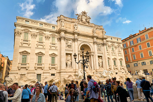 Crowd of tourists visiting Trevi Fountain in Rome Italy by Marco Brivio
