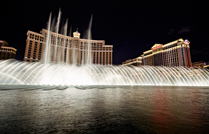Fountains dance at Bellagio in Las Vegas during night show by Marco Brivio