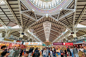 Visitors explore stalls in Central Market of Valencia Spain by Marco Brivio