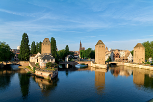 Covered bridges in Strasbourg by the river on a clear day by Marco Brivio