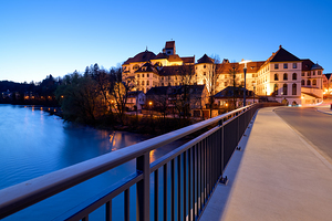 View of St. Mang Abbey at dusk along the Lech River in Bavaria by Marco Brivio