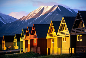 Colorful houses in Longyearbyen Svalbard at sunset by Marco Brivio
