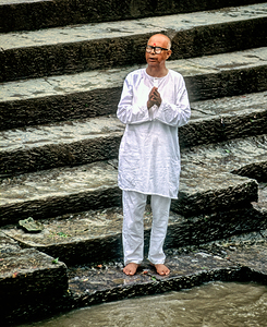 Pilgrim praying at Pashupatinath temple in Kathmandu Nepal by Marco Brivio