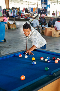 Playing pool in the covered market of Rundu in Namibia by Marco Brivio