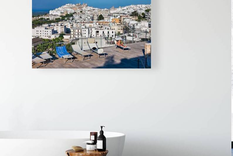 Apulia Puglia Italy. Ostuni. Elevated view of the town from the a rooftop pool by Marco Brivio