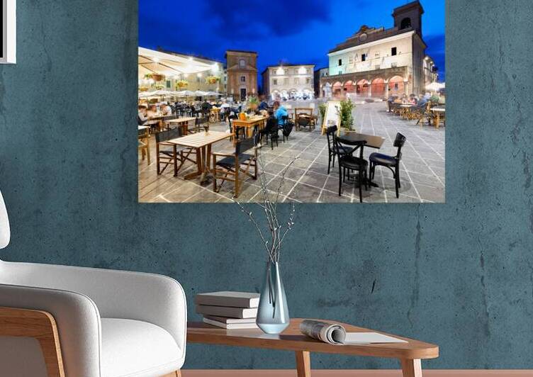 Montefalco Umbria Italy. Piazza del Comune at sunset. People eating out by Marco Brivio