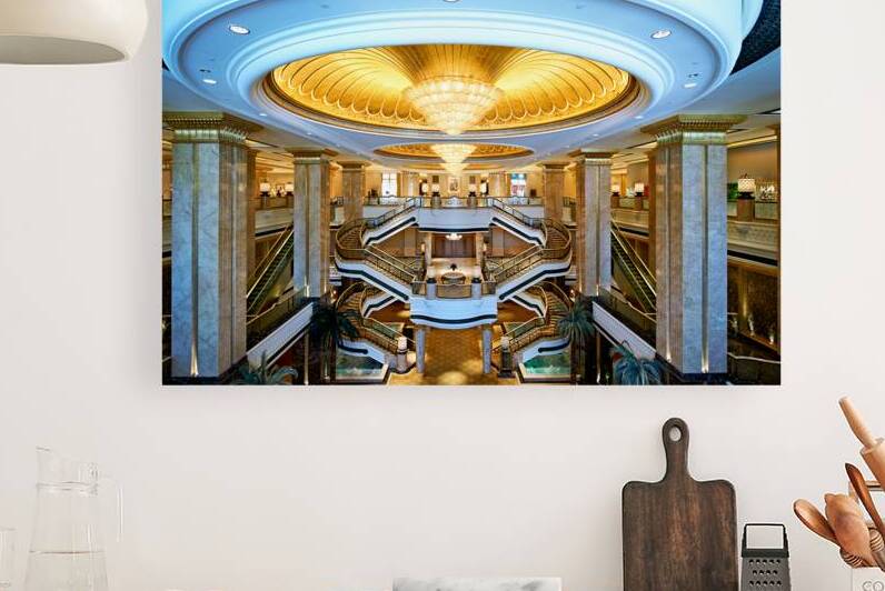 Opulent hotel lobby with grand staircases and golden dome. by Marco Brivio