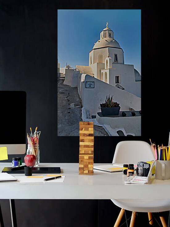 Santorinis white church with dome and cross against blue sky. by Marco Brivio