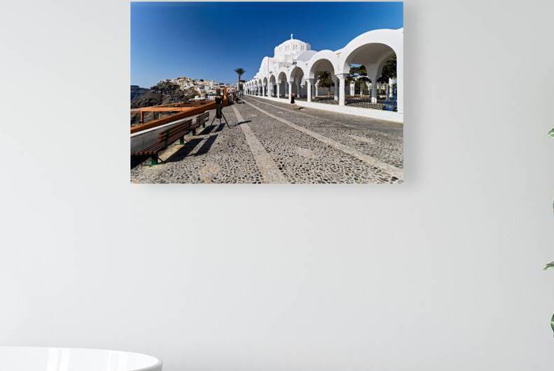 Santorinis iconic white church cobblestone path and cliffside by Marco Brivio