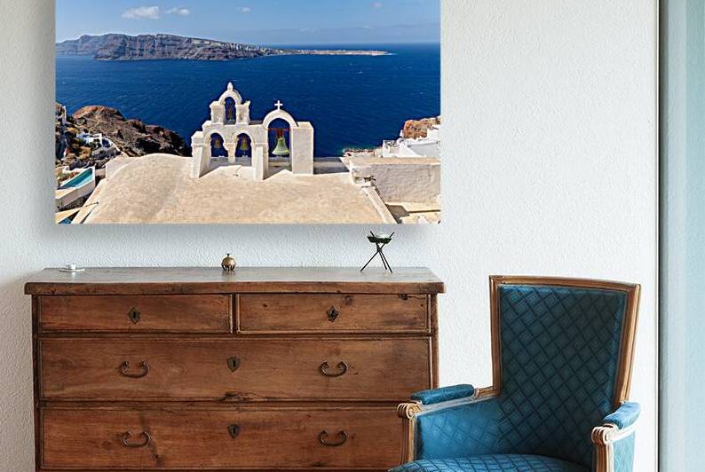 Iconic Santorini bell tower overlooking the caldera and Aegean S by Marco Brivio