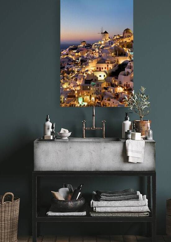 Santorinis iconic white village and windmills illuminated at tw by Marco Brivio