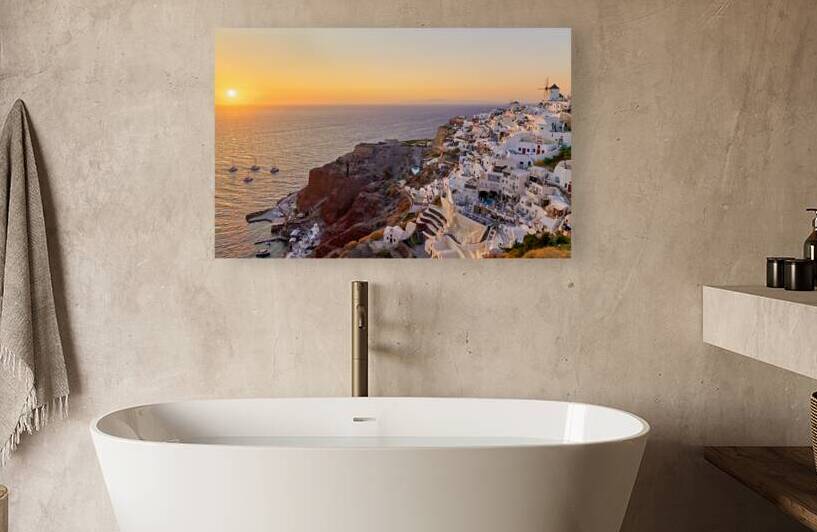 Sunset over Santorinis white village windmills and sea. by Marco Brivio