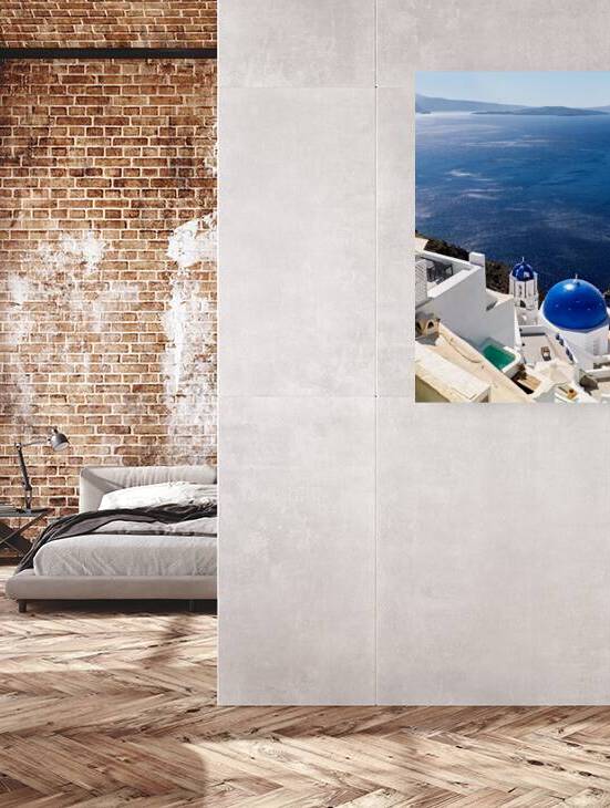 Santorini: White buildings blue domes and sparkling sea. by Marco Brivio