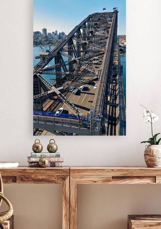 Sydney Harbour Bridge with traffic and city skyline. by Marco Brivio