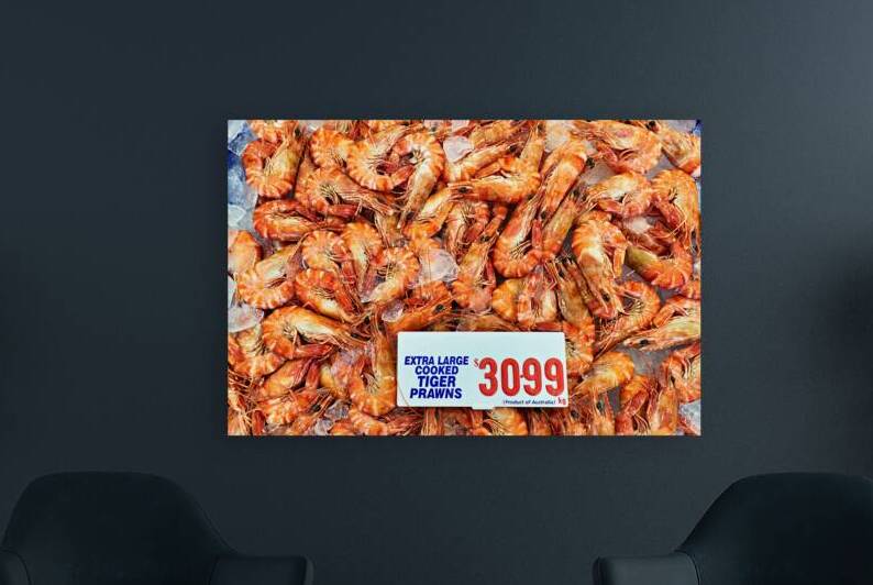 Extra large cooked tiger prawns on ice for sale. by Marco Brivio