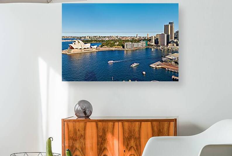 Sydney Opera House and harbor with ferries on a sunny day. by Marco Brivio