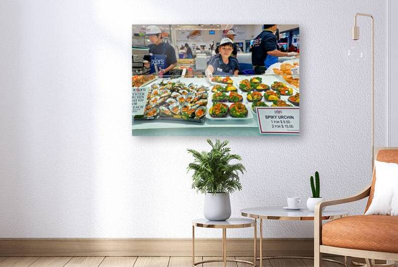 Fresh oysters and spiky urchin for sale at market. by Marco Brivio