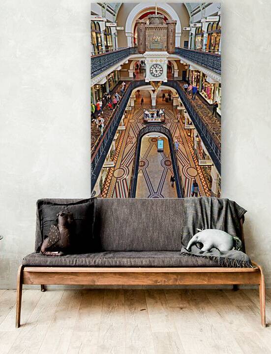 Elegant interior of a multi level shopping arcade with clock. by Marco Brivio