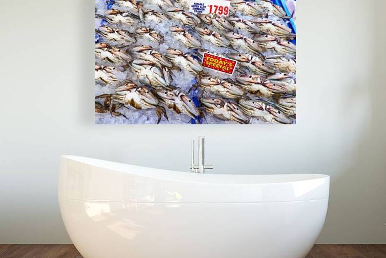 Fresh female blue swimmer crabs on ice for sale. by Marco Brivio