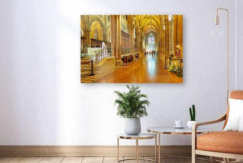 Interior of a grand cathedral with stained glass windows. by Marco Brivio