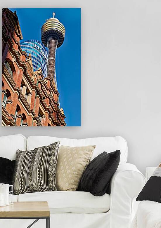 Sydney Tower and J.P. Morgan building against blue sky. by Marco Brivio