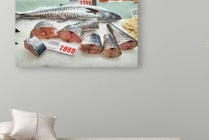 Fresh Spanish Mackerel and Salmon displayed on ice. by Marco Brivio