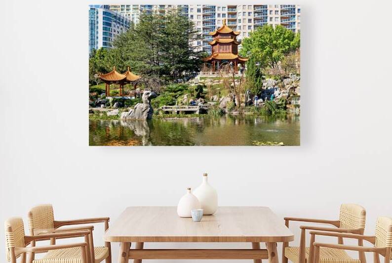 Serene Chinese garden with pagodas pond and urban high rises. by Marco Brivio