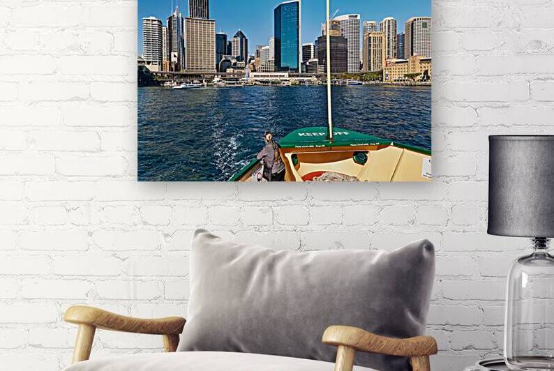 Sydney skyline viewed from a ferry on a sunny day. by Marco Brivio