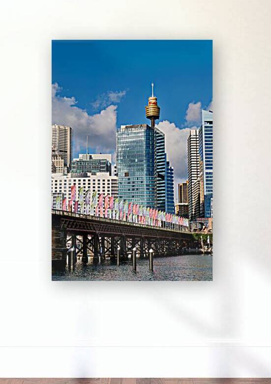 Sydney Harbour Bridge with colorful flags and city skyline. by Marco Brivio