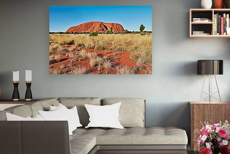 Uluru Australias iconic sandstone monolith under a clear blue by Marco Brivio