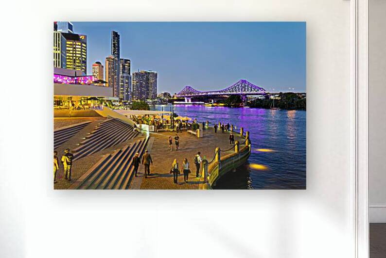 Brisbanes Story Bridge and riverfront promenade bustling at nig by Marco Brivio