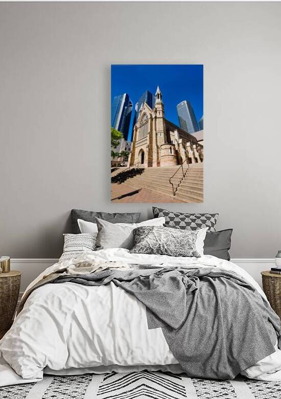 Historic church stands tall against modern skyscrapers. by Marco Brivio