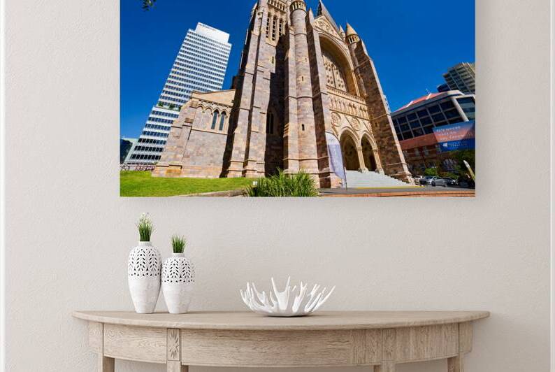 Historic church stands tall next to modern skyscrapers. by Marco Brivio