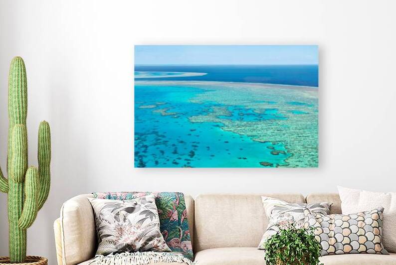 Aerial view of the Great Barrier Reefs turquoise waters. by Marco Brivio