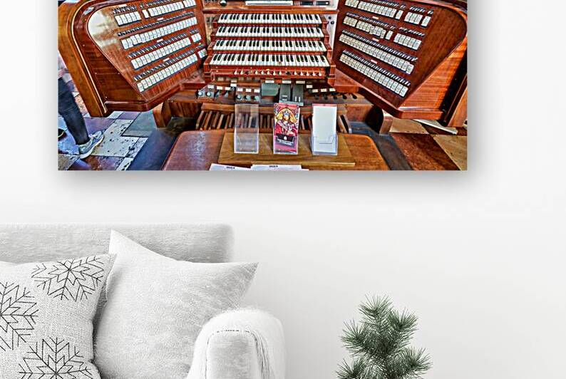 Intricate wooden pipe organ console with multiple keyboards and  by Marco Brivio