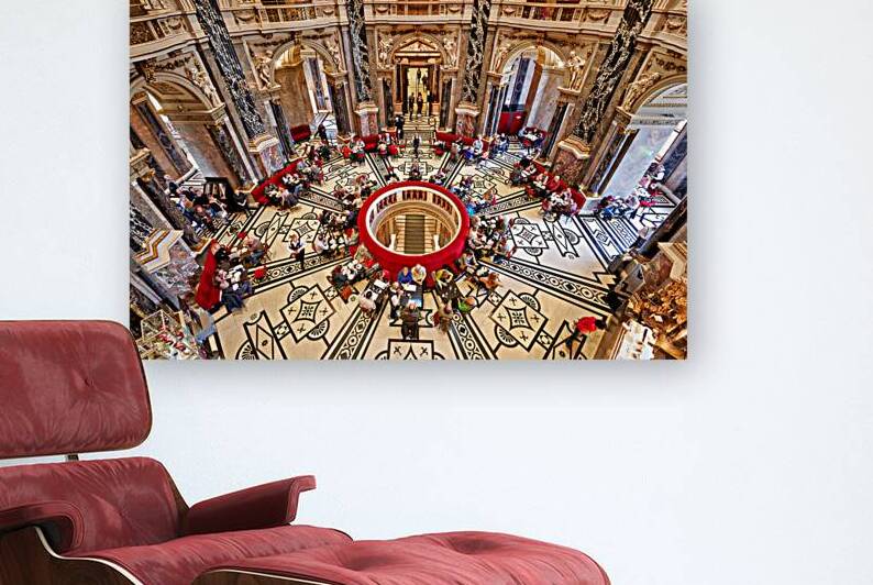 People dining in a grand ornate historic cafe interior. by Marco Brivio