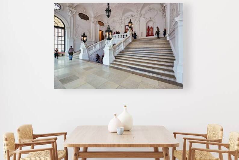 Visitors exploring a grand ornate staircase in a historic palac by Marco Brivio