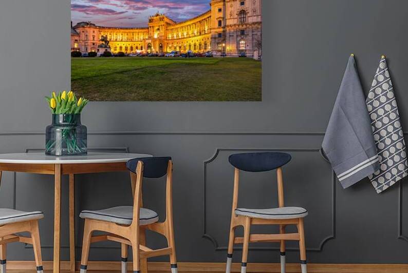 Illuminated Hofburg Palace in Vienna at sunset with vibrant sky. by Marco Brivio