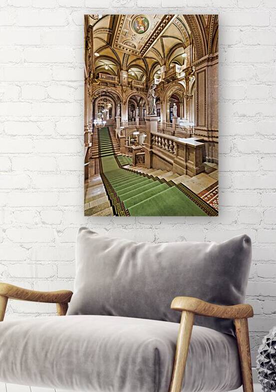 Ornate grand staircase with green carpet and classical statues. by Marco Brivio