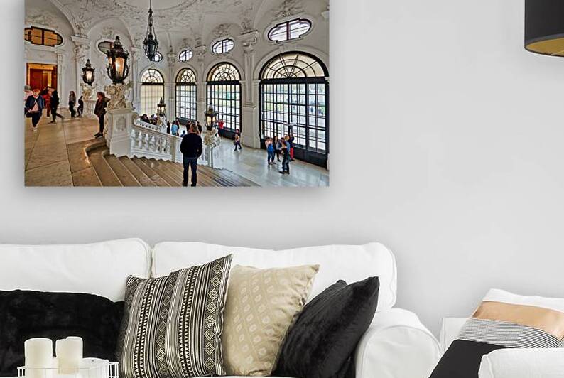 Ornate palace interior with grand staircase and many visitors. by Marco Brivio