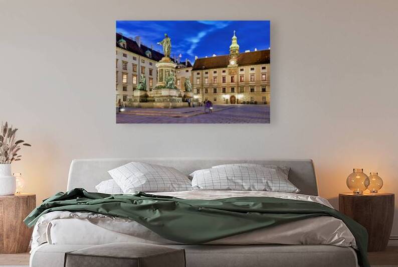 Monument in illuminated Hofburg courtyard Vienna at night. by Marco Brivio