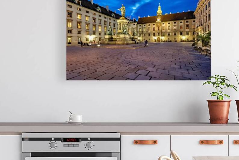 Hofburg Palace square at night with illuminated buildings and st by Marco Brivio
