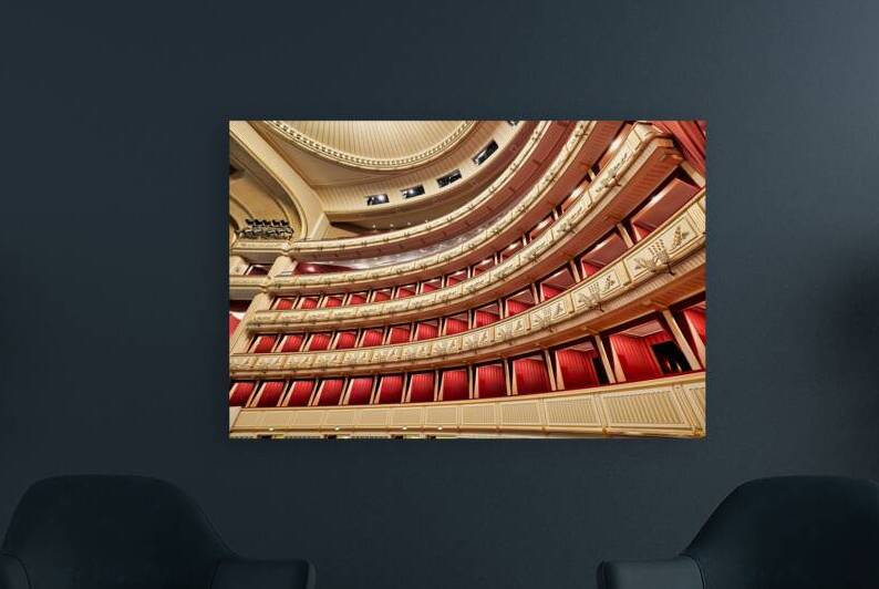 Ornate opera house interior with tiered red and gold balconies. by Marco Brivio