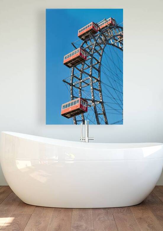 Ferris wheels red cabins against a clear blue sky. by Marco Brivio