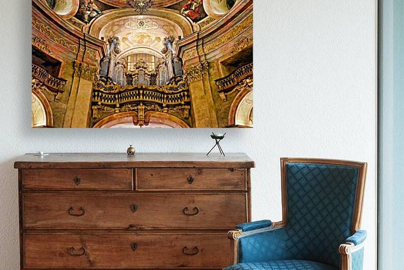 Grand baroque church interior featuring ornate organ frescoes  by Marco Brivio