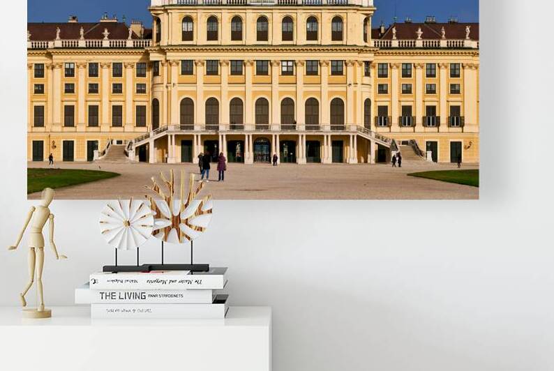 Ornate yellow palace facade with people and blue sky. by Marco Brivio